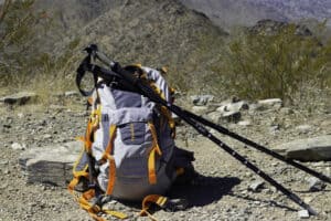 Backpack and hiking poles sitting on top of Thompson Peak